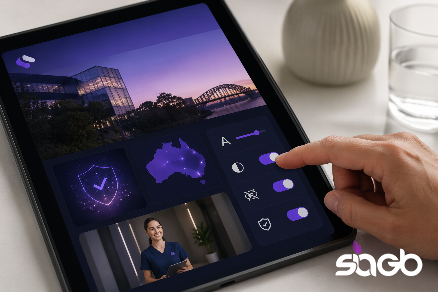 Tablet displaying a Sydney Harbour Bridge clinic dashboard with accessibility toggles, a map of Australia, and a security shield icon