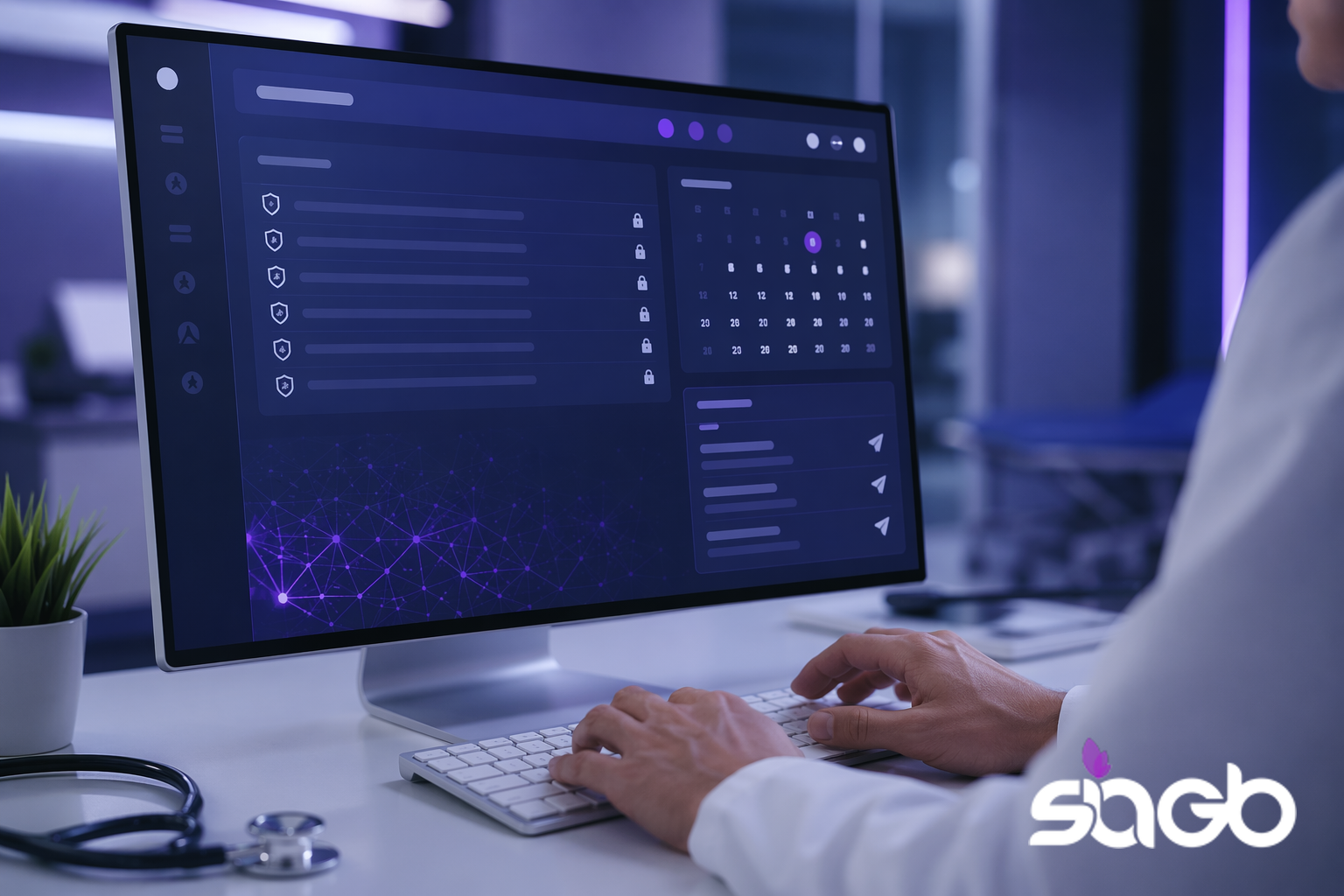 Clinician in a white coat typing at a desk while a navy and purple healthcare dashboard fills the monitor